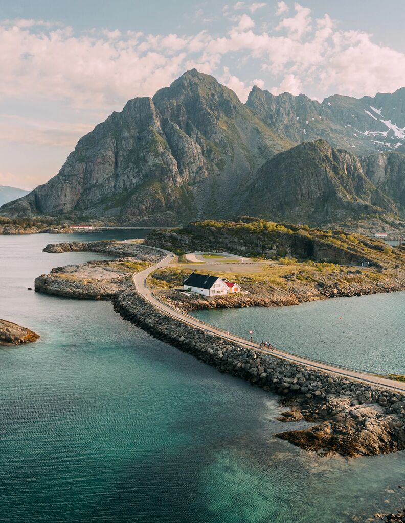 Cycling on road raised over fjord