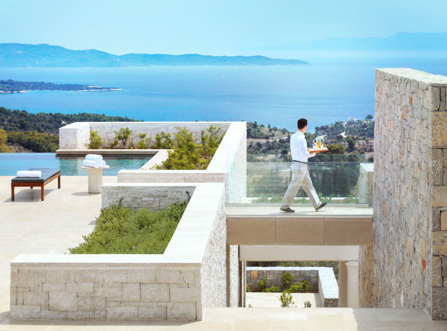 Waiter walking at private villa in Greece