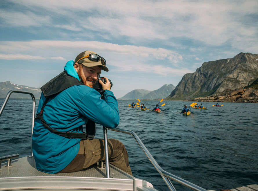 A photographer captures clients in kayaks