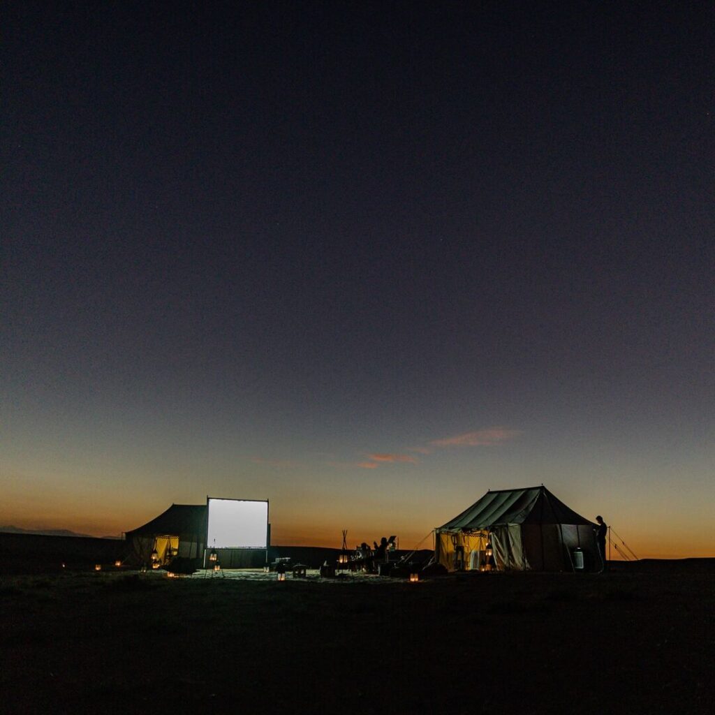 Desert camp with cinema setup